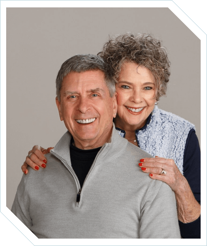 A man and woman posing for the camera.